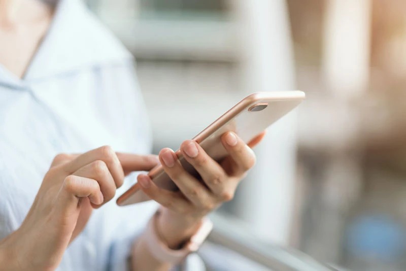 Dental Patient Using Their Phone