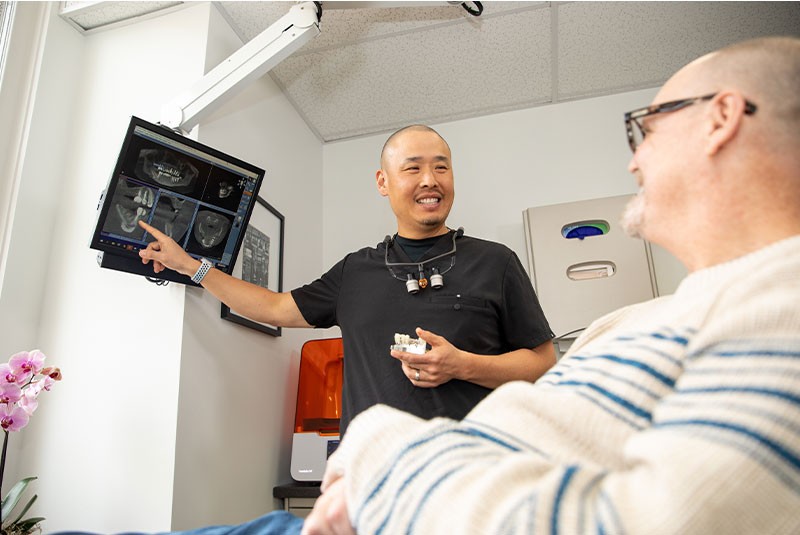 Doctor showing patient imaging display